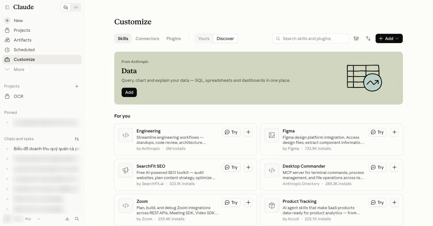Trang Customize, tab Skills, chế độ Discover: ô tìm, nút lọc, sắp xếp và Add; banner Data của Anthropic; mục For you với sáu thẻ như Engineering, Figma, SearchFit SEO, Desktop Commander, Zoom, Product Tracking, mỗi thẻ có nút Try và nút +.